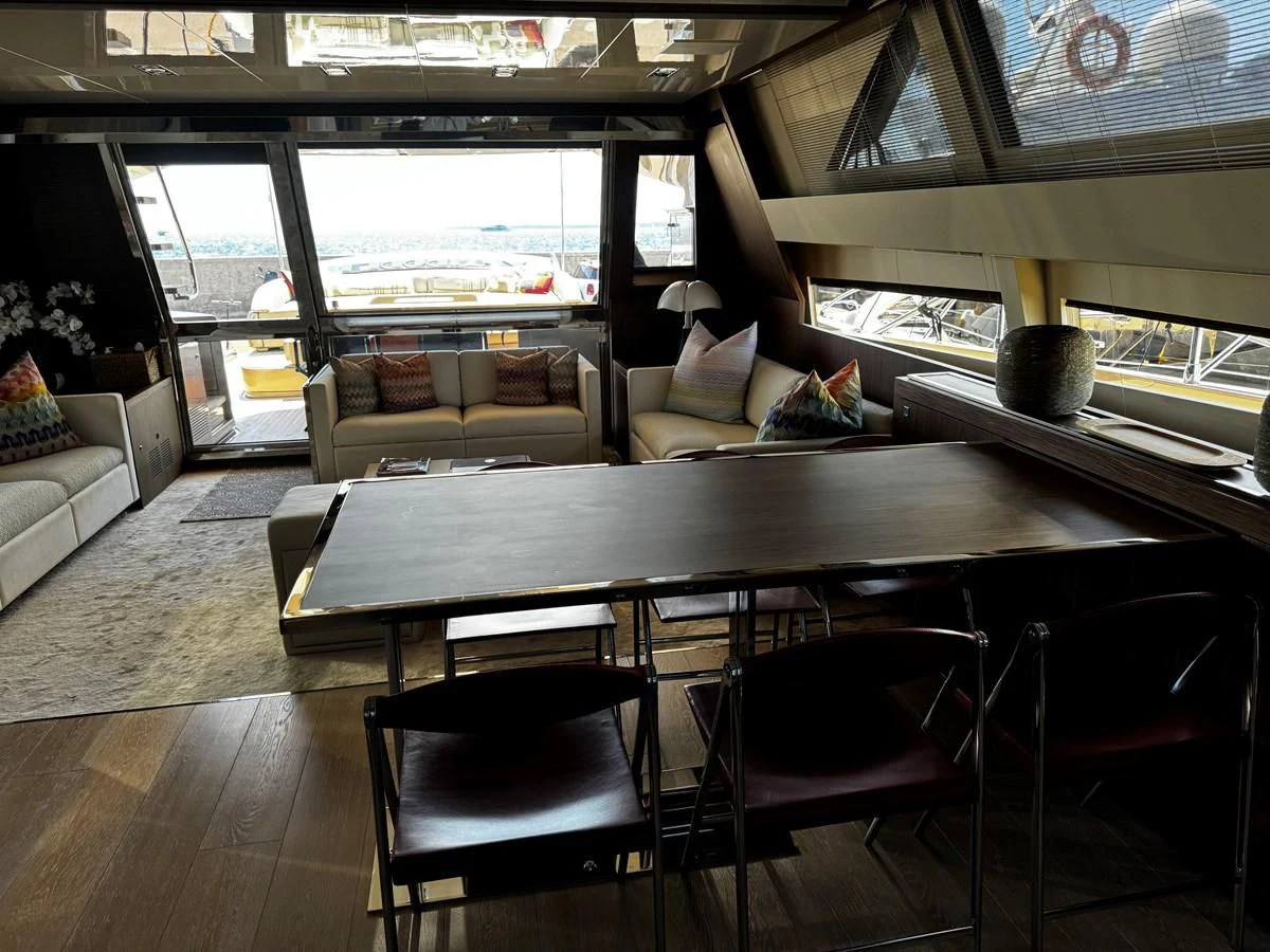 a room with a table and chairs aboard M Yacht for Sale