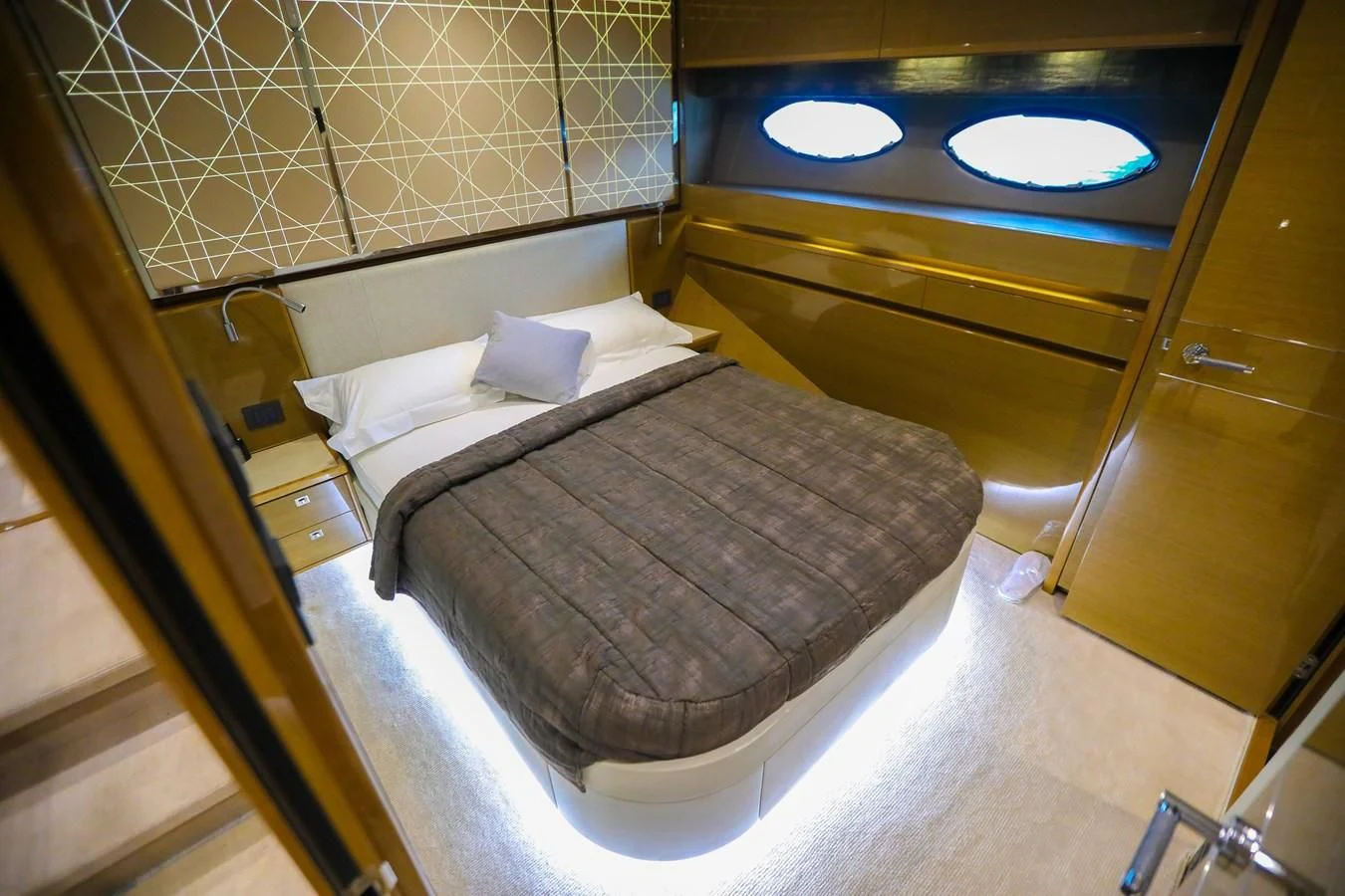 a bed in a room aboard M Yacht for Sale
