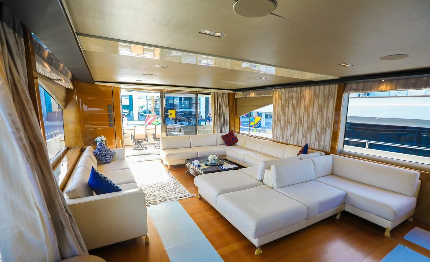 a living room with a large window aboard M Yacht for Sale