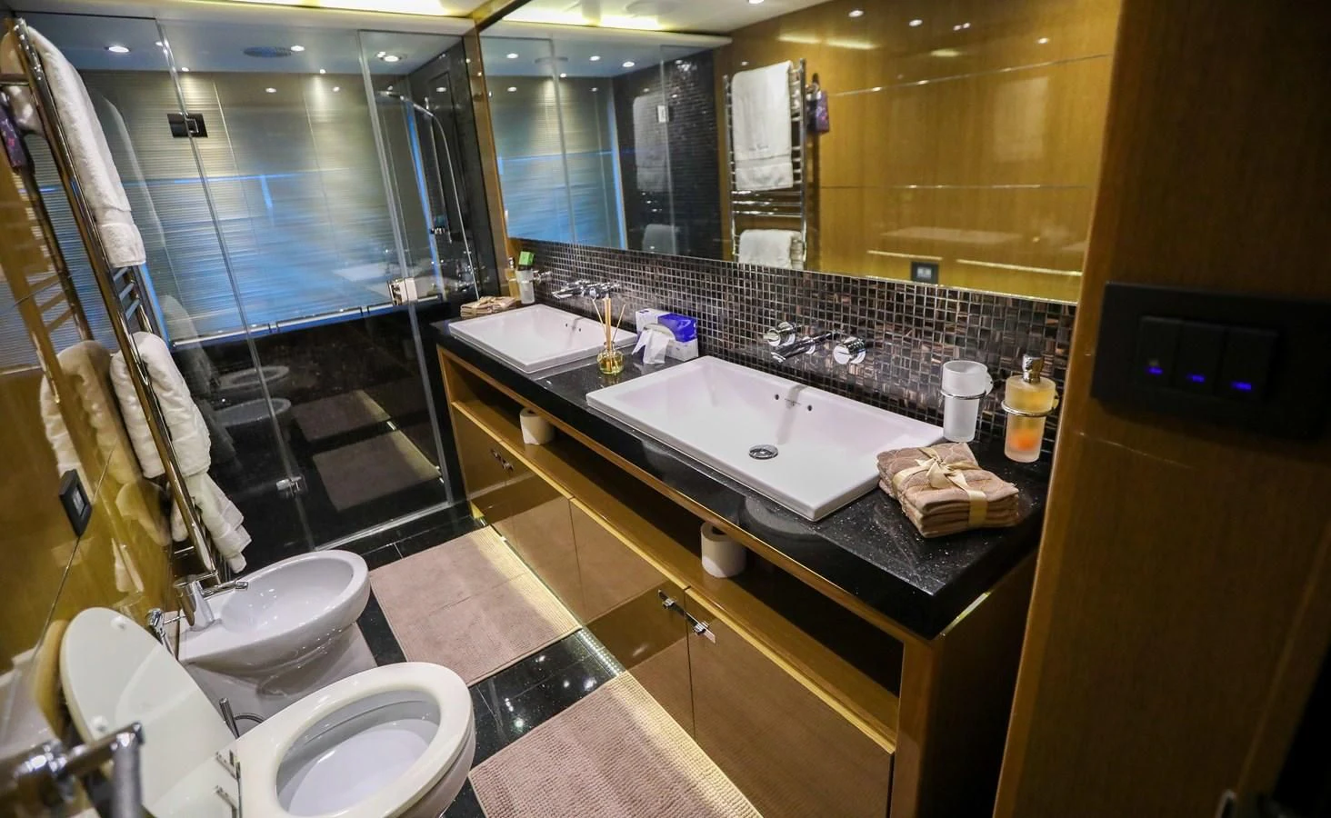 a bathroom with a large mirror aboard M Yacht for Sale