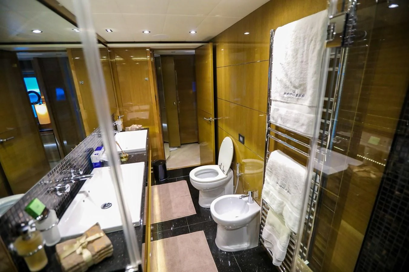 a bathroom with a glass shower aboard M Yacht for Sale