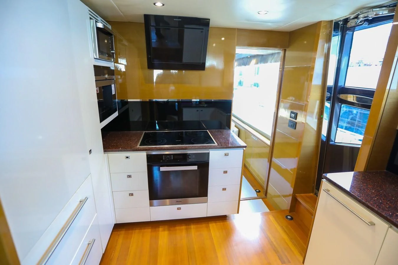 a kitchen with a stove and oven aboard M Yacht for Sale