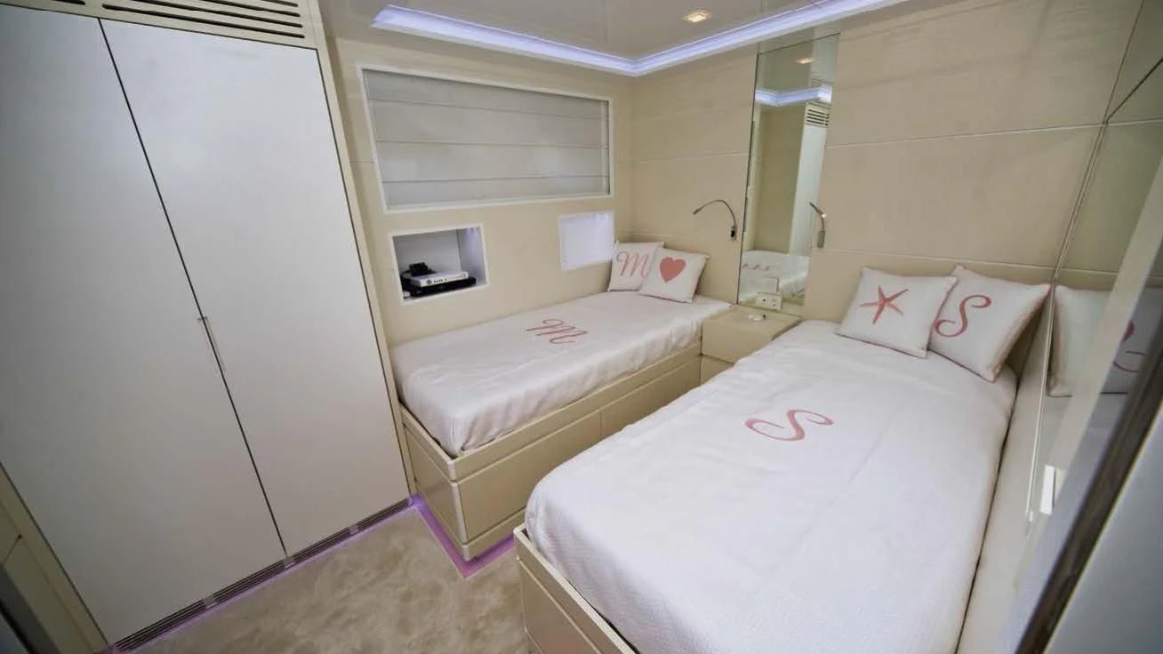 a couple of beds in a hotel room aboard OCEAN KING 88 Yacht for Sale