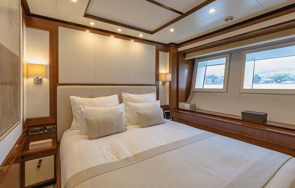 a bed in a room aboard NEW WAVES Yacht for Sale