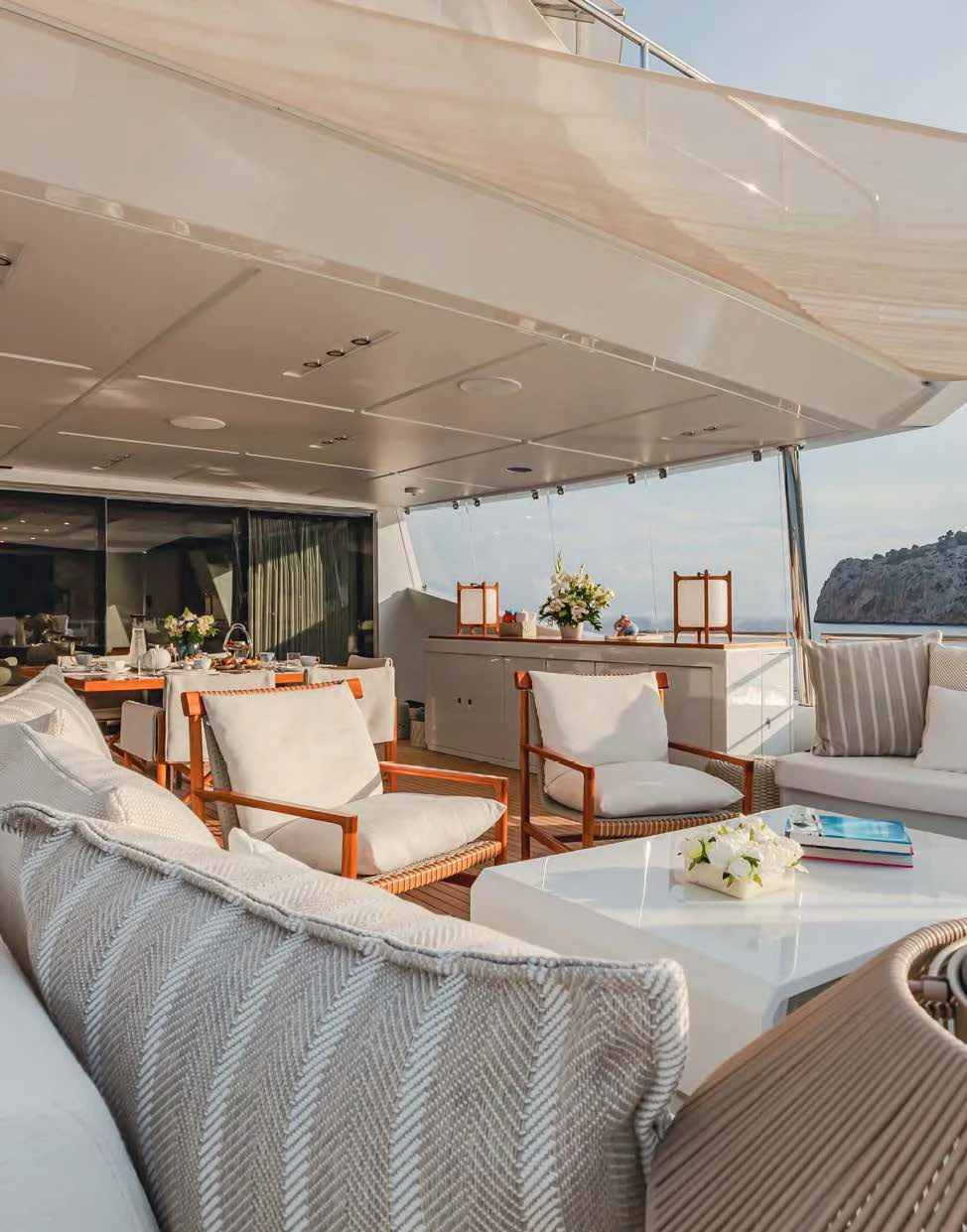 a room with a table chairs and a large window aboard NEW WAVES Yacht for Sale