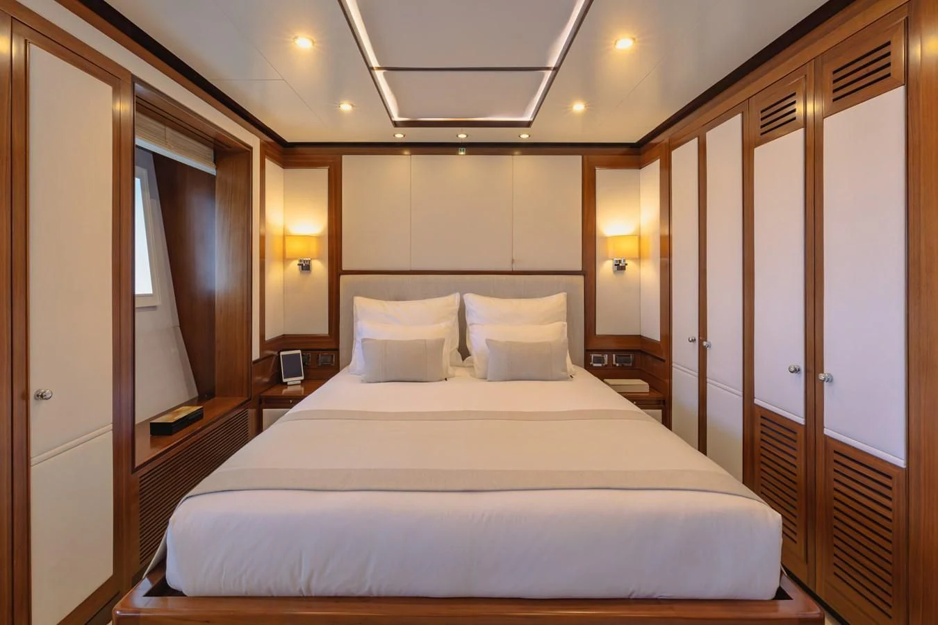 a large bed in a hotel room aboard NEW WAVES Yacht for Sale