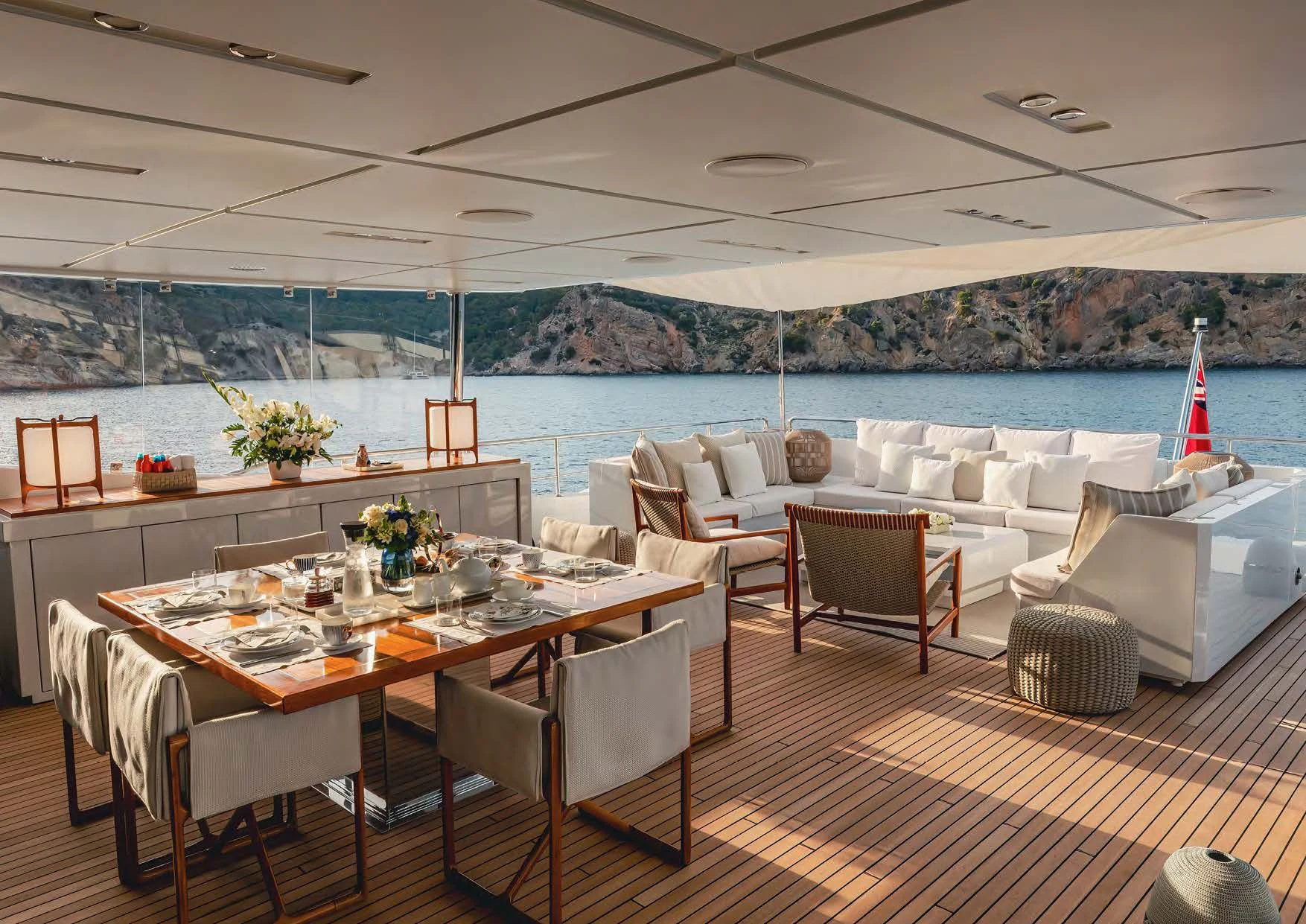 a room with a table and chairs aboard NEW WAVES Yacht for Sale