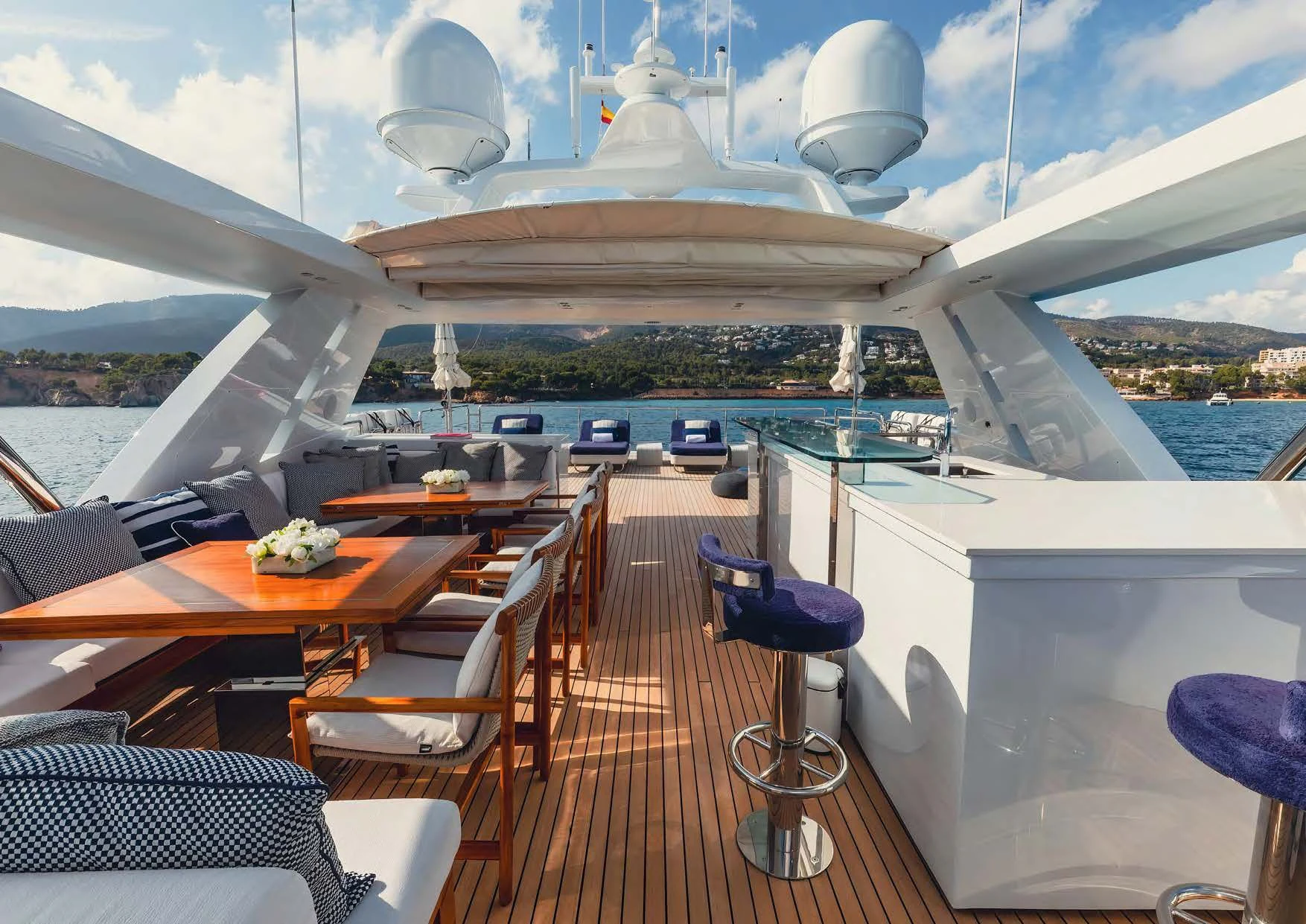 a deck with a large ship in the background aboard NEW WAVES Yacht for Sale