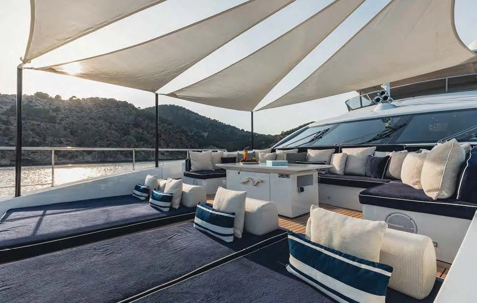 a large living room with a large patio and a large window aboard NEW WAVES Yacht for Sale