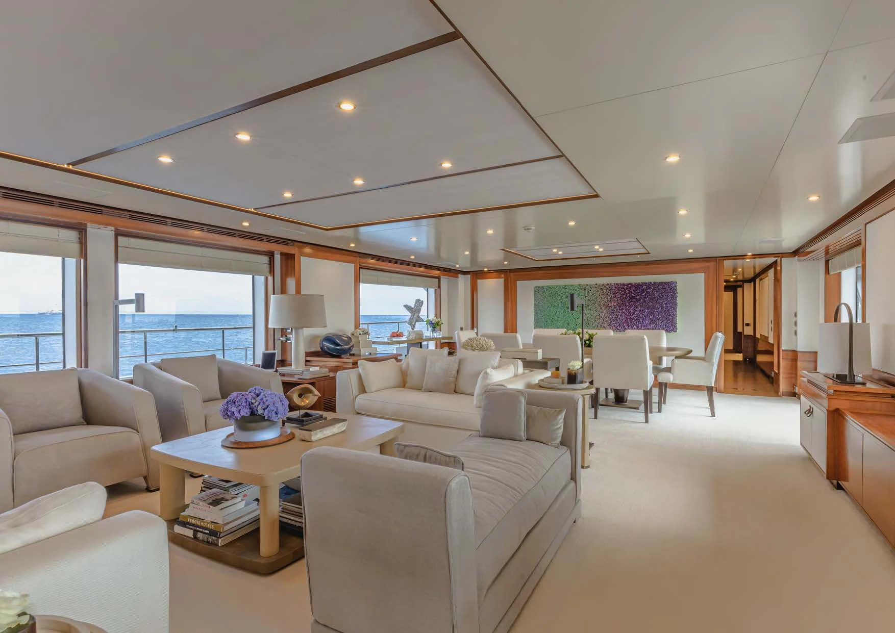a living room with a large window aboard NEW WAVES Yacht for Sale