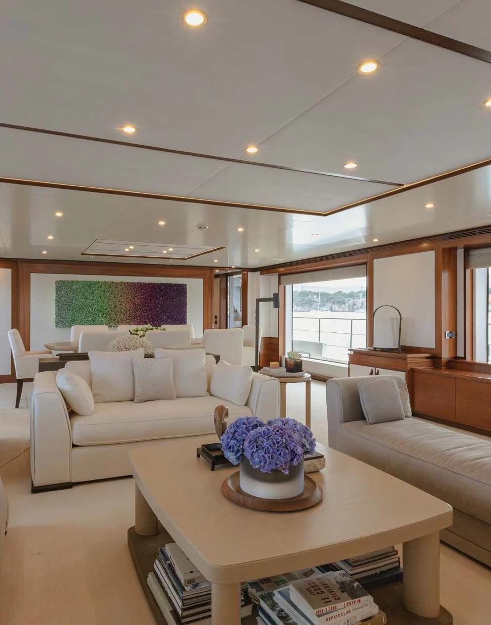 a living room with a couch and a coffee table aboard NEW WAVES Yacht for Sale