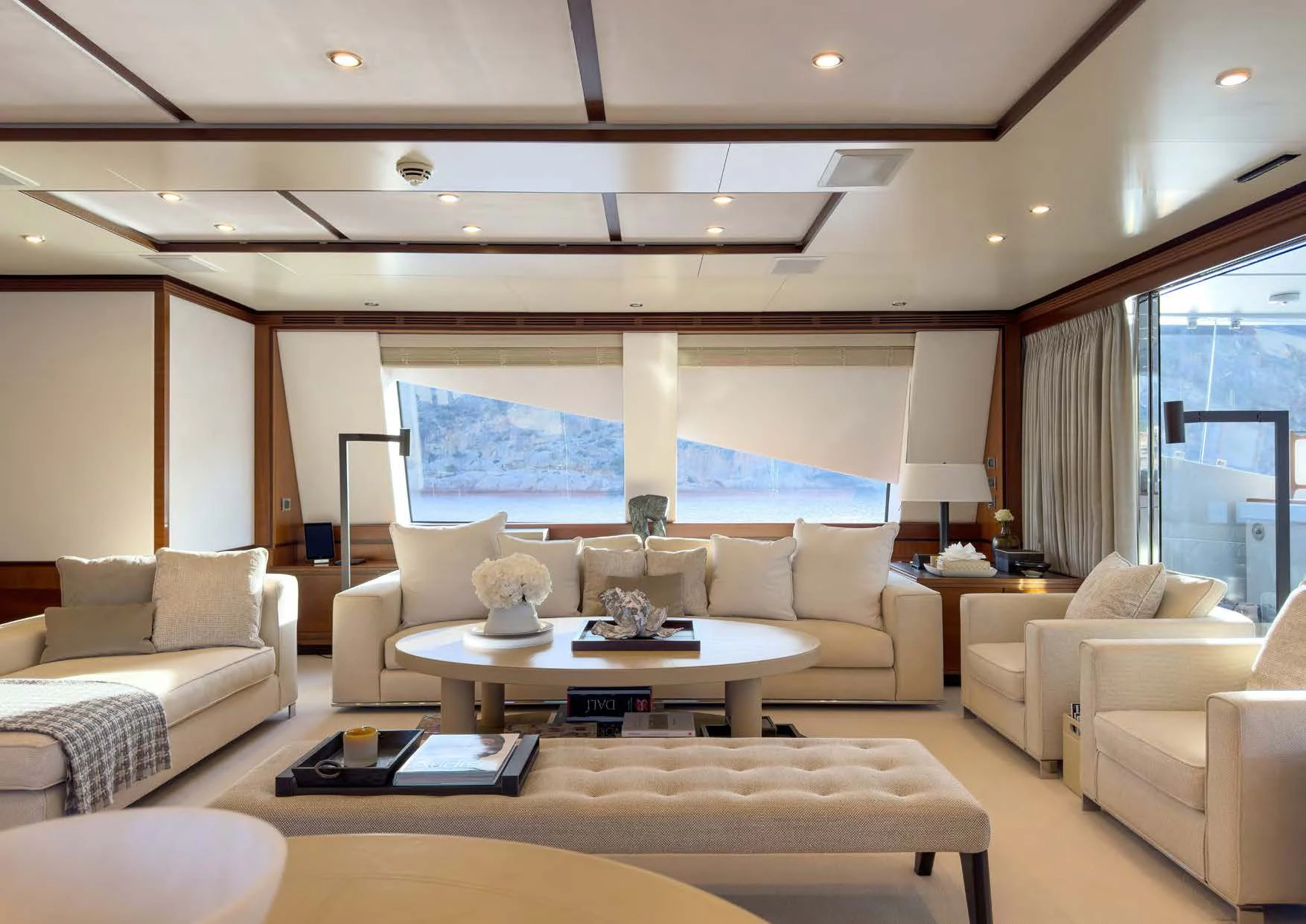 a living room with a large window aboard NEW WAVES Yacht for Sale