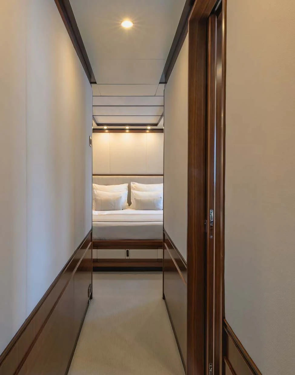 a hallway with a bed and a couch aboard NEW WAVES Yacht for Sale