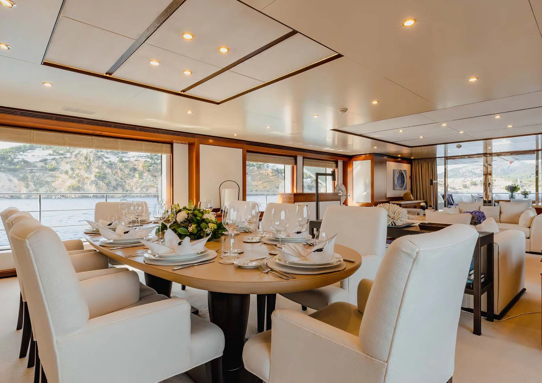 a dining room with a table and chairs aboard NEW WAVES Yacht for Sale
