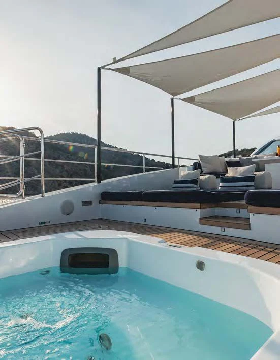 a pool with a large glass window aboard NEW WAVES Yacht for Sale