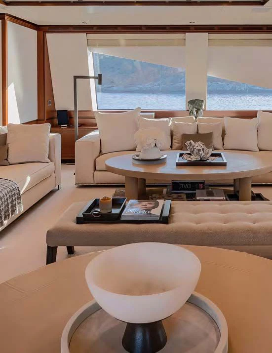 a living room with a large window aboard NEW WAVES Yacht for Sale