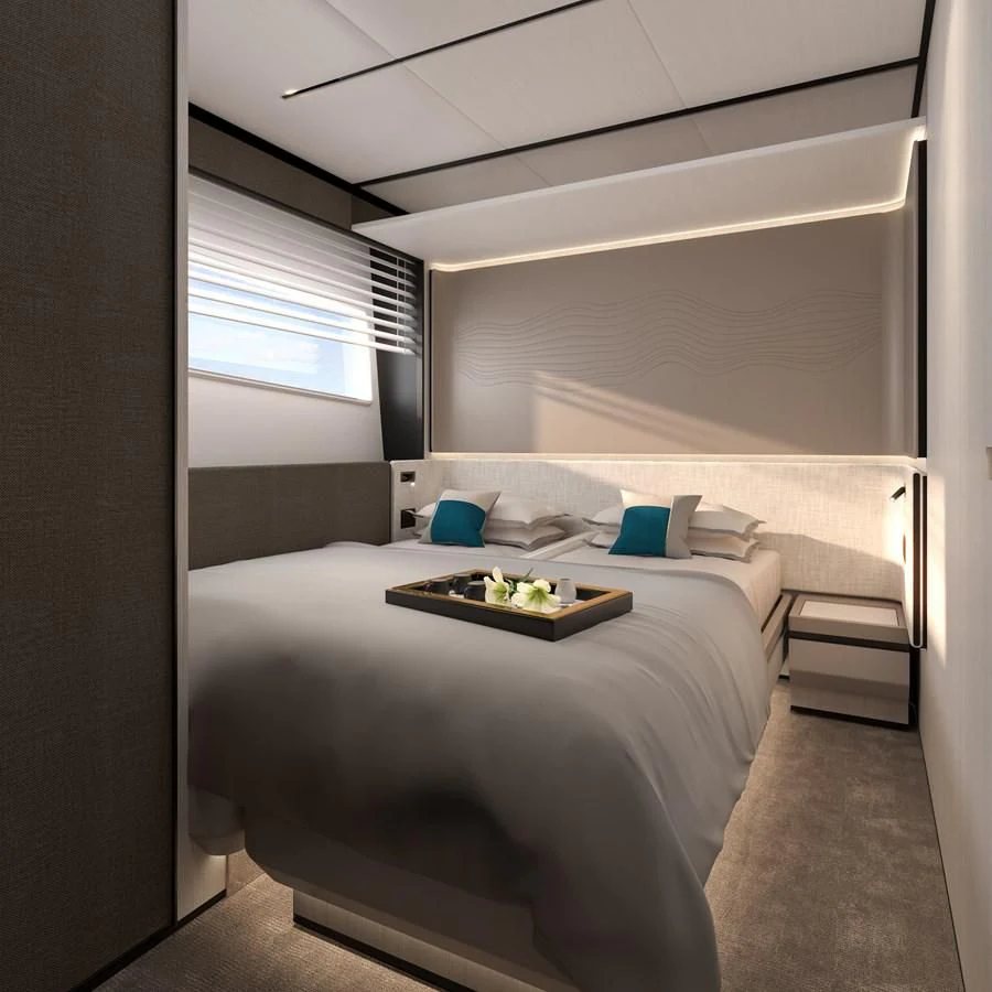 a bedroom with a bed and a desk aboard ALKHADRA Yacht for Charter