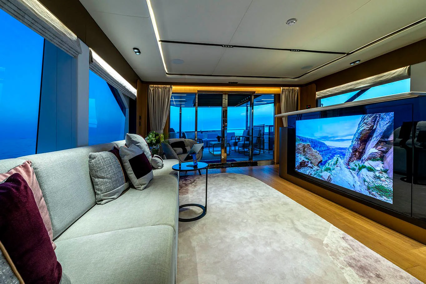 a living room with a large screen aboard ALKHADRA Yacht for Charter