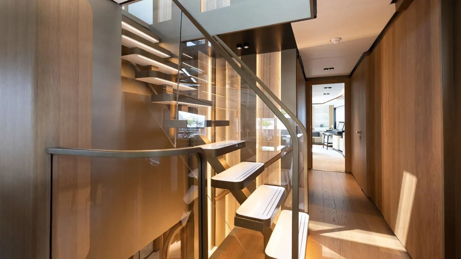 a staircase with wooden railings aboard ALKHADRA Yacht for Charter