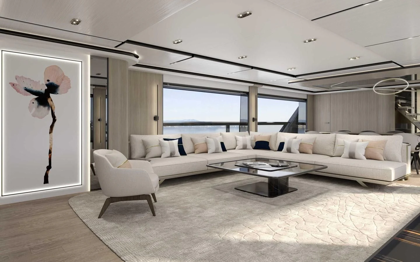 a living room with a large white sofa and a large window aboard ALKHADRA Yacht for Charter