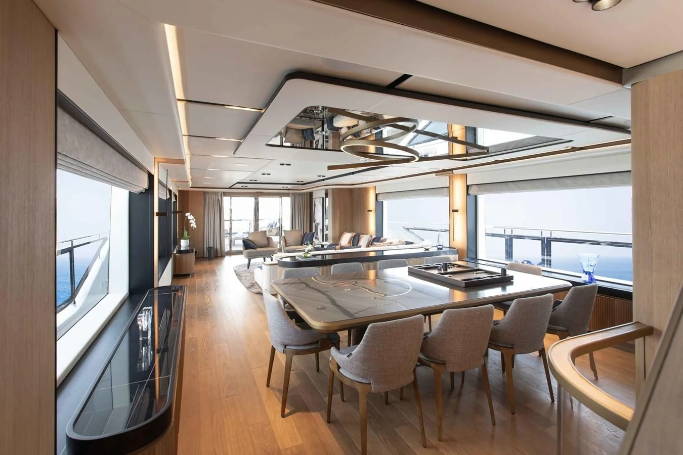 a large room with a large table and chairs aboard ALKHADRA Yacht for Charter