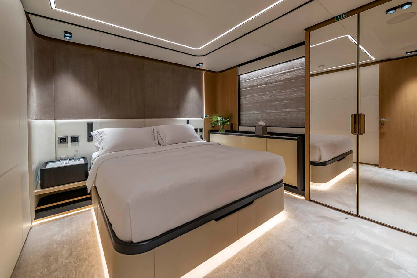 a room with a bed and a closet aboard ALKHADRA Yacht for Charter