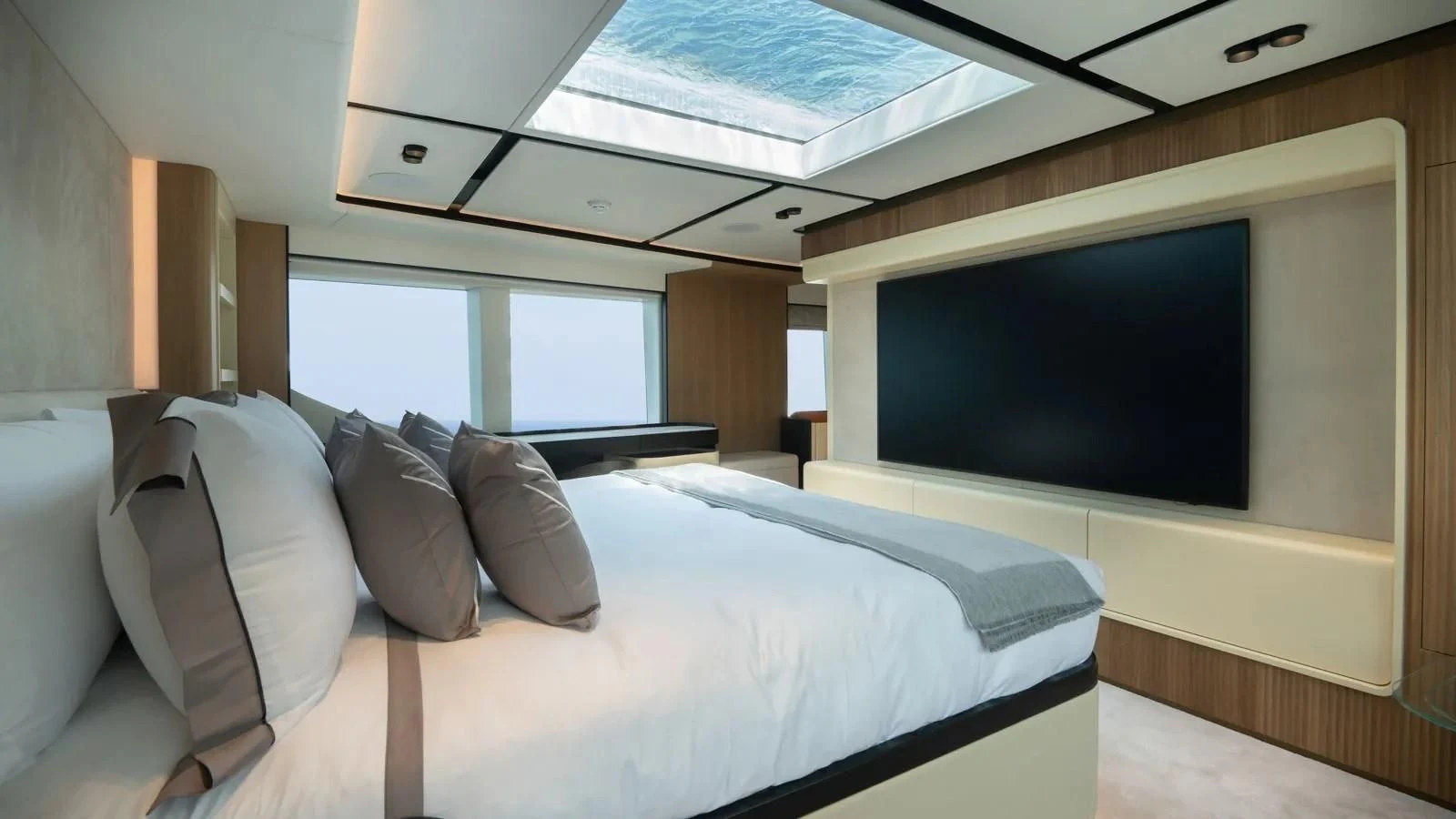 a room with a bed and a tv aboard ALKHADRA Yacht for Charter