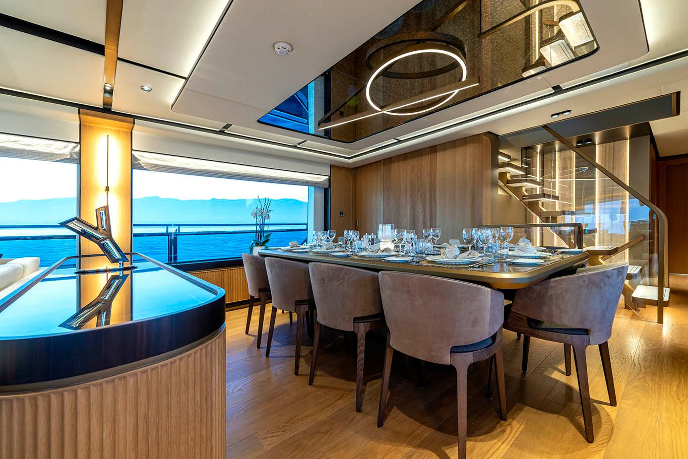 a room with a table and chairs aboard ALKHADRA Yacht for Charter