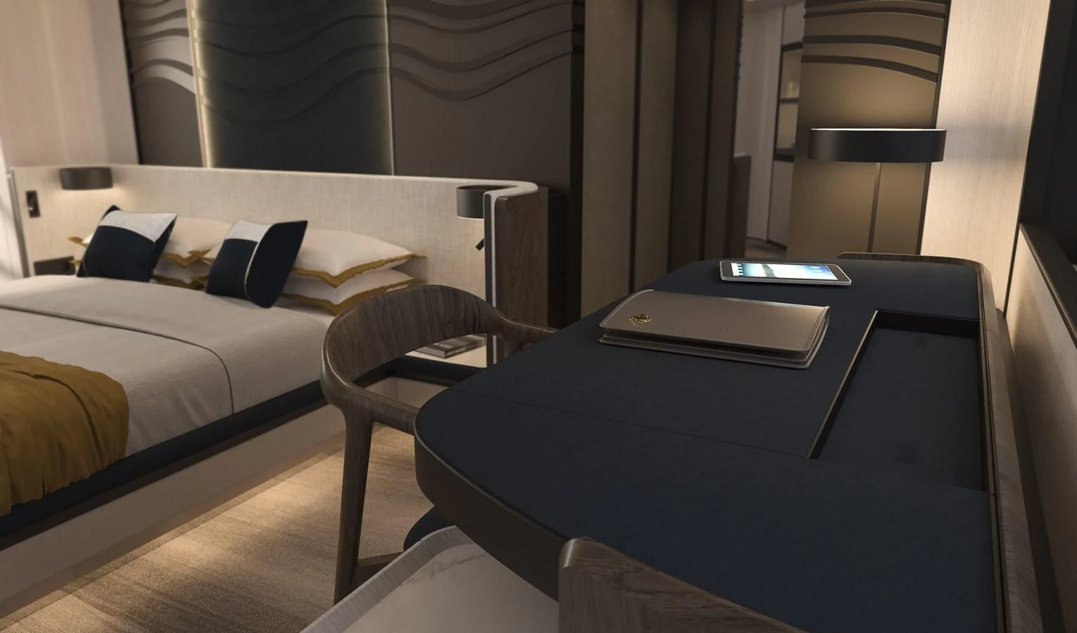 a bed with a desk and a laptop on it aboard ALKHADRA Yacht for Charter