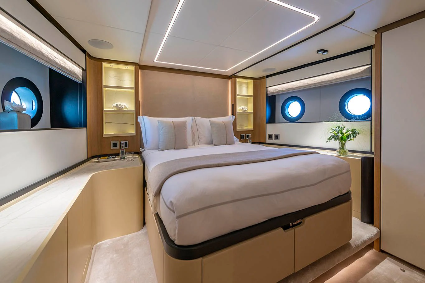 a room with a bed and a mirror aboard ALKHADRA Yacht for Charter