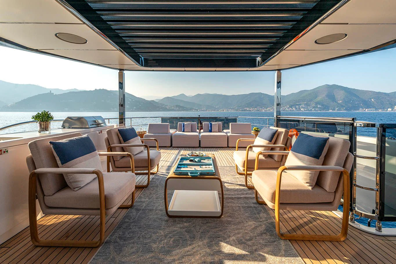 a deck with chairs and a table aboard ALKHADRA Yacht for Charter
