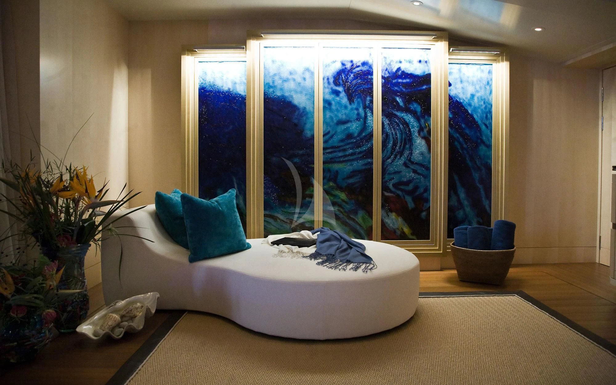 a white bed with blue pillows aboard SEA RHAPSODY Yacht for Sale