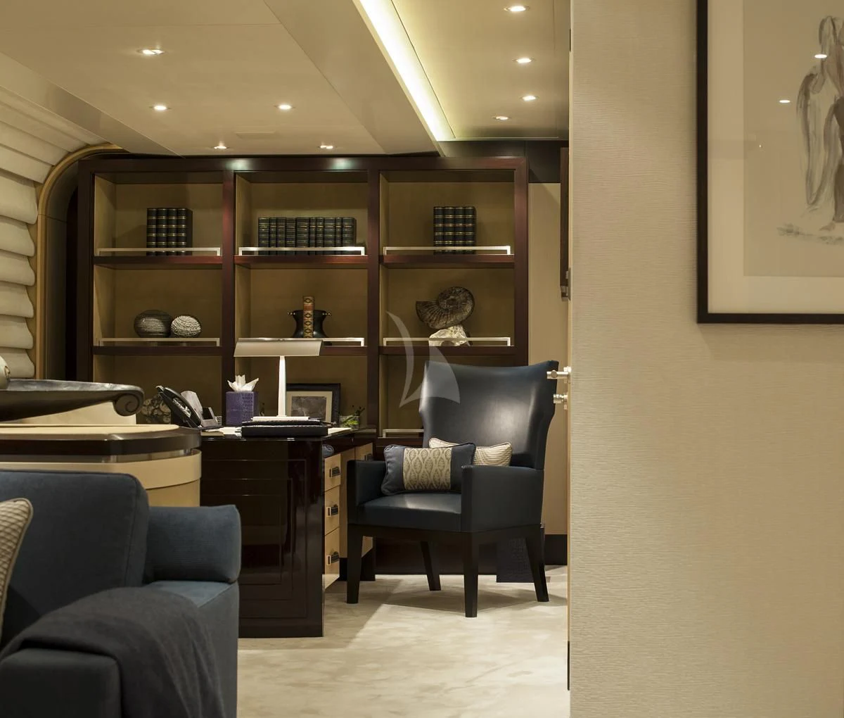 a room with a bookcase and a chair aboard SEA RHAPSODY Yacht for Sale