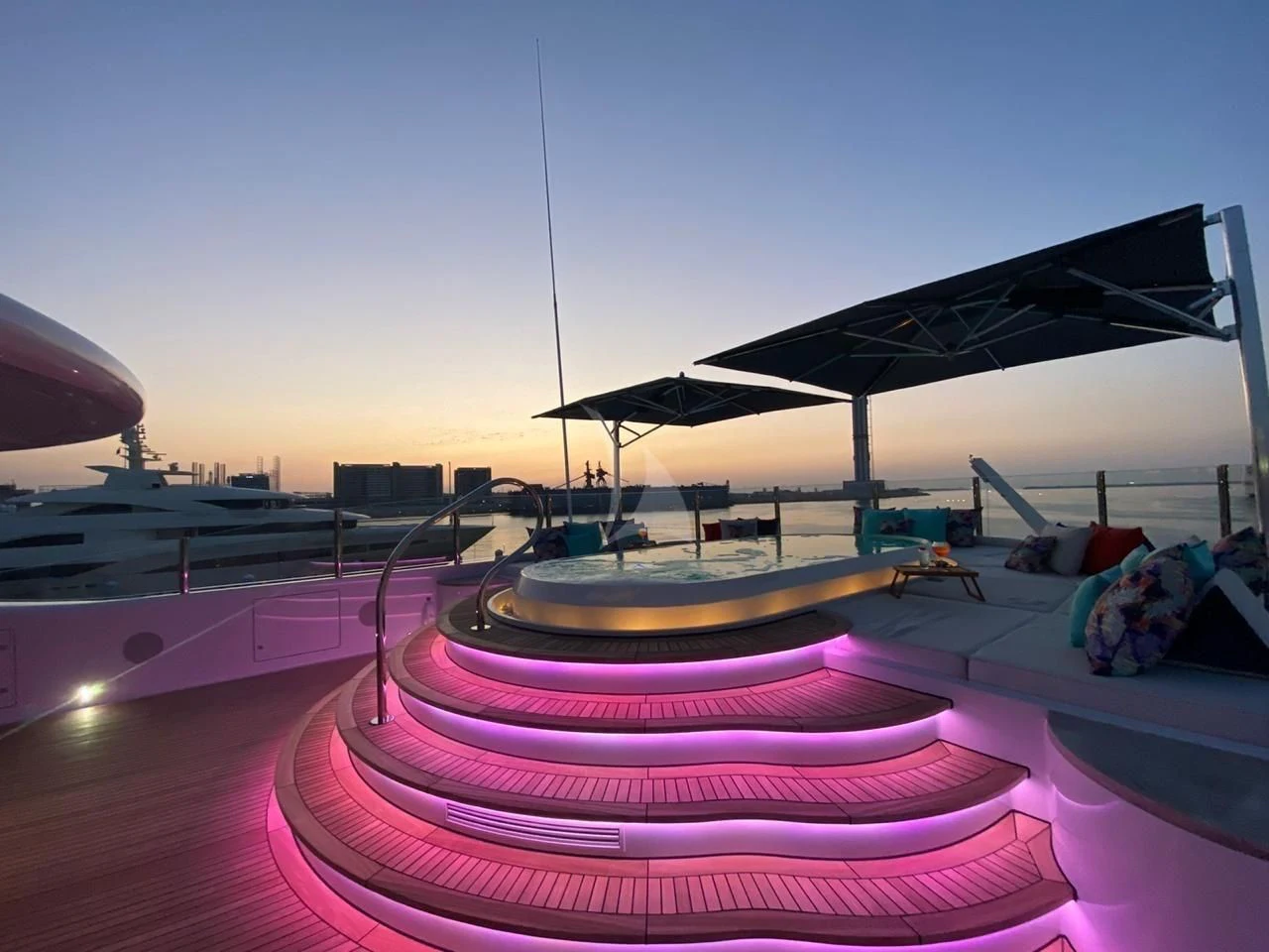 a rooftop with a roof and a building in the background aboard SEA RHAPSODY Yacht for Sale