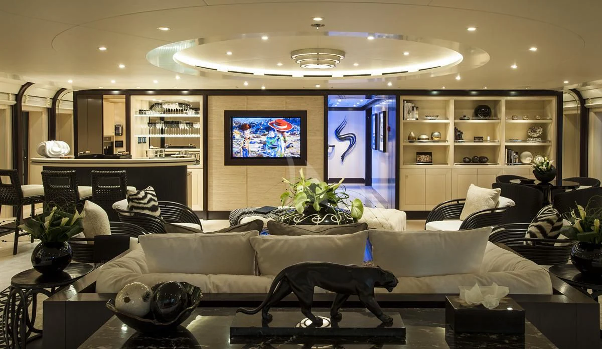 a dog on a couch in a living room aboard SEA RHAPSODY Yacht for Sale