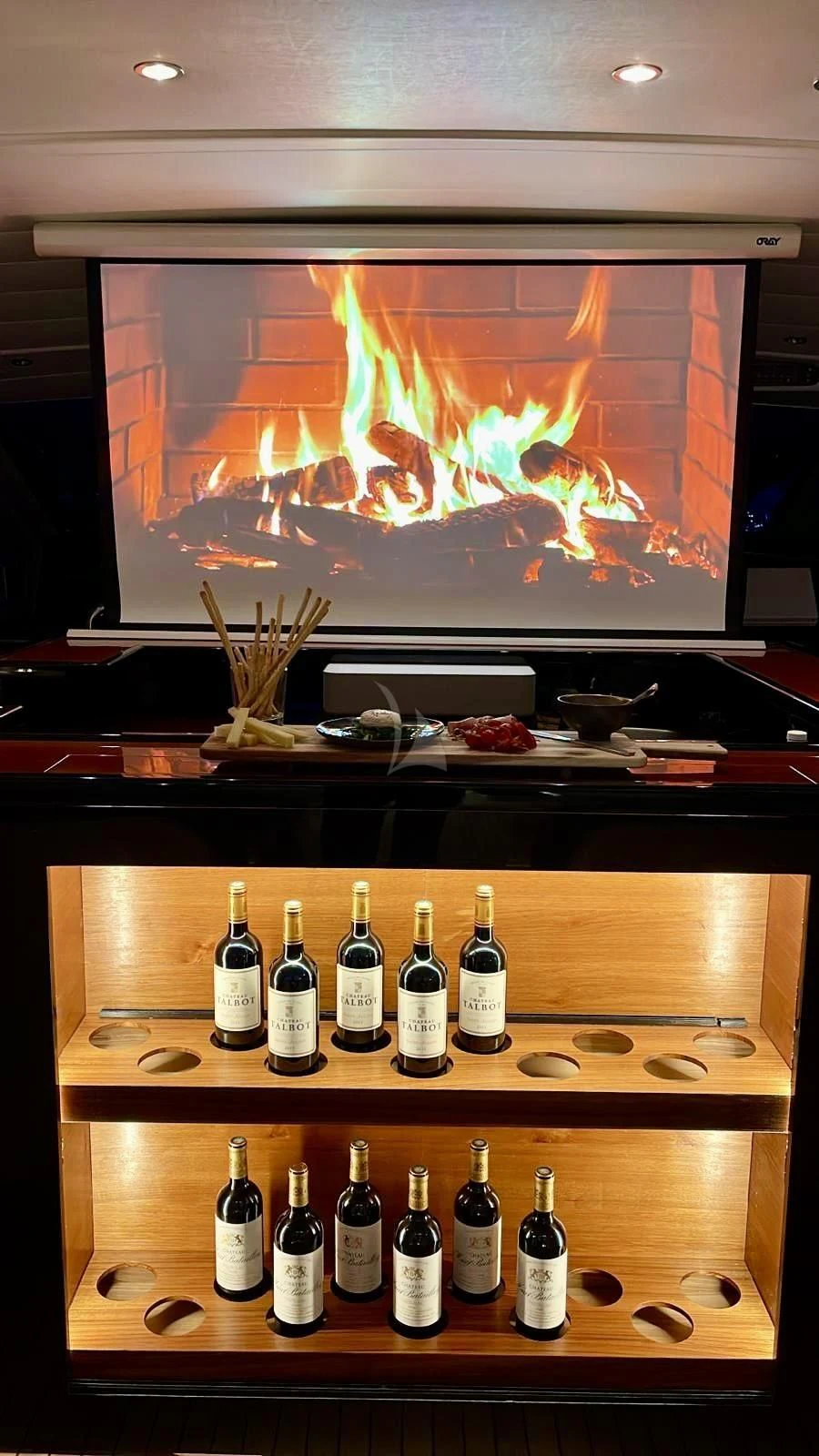 bottles of liquor on a shelf aboard NOTORIOUS Yacht for Sale