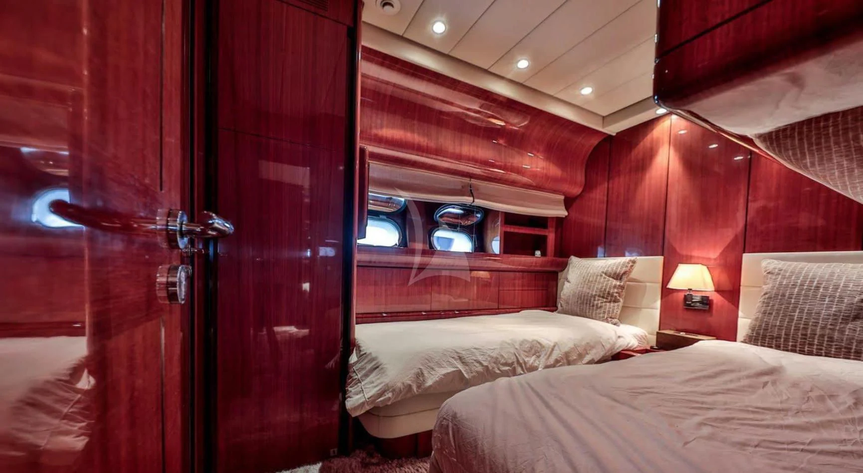 a room with a bed and a door aboard NOTORIOUS Yacht for Sale
