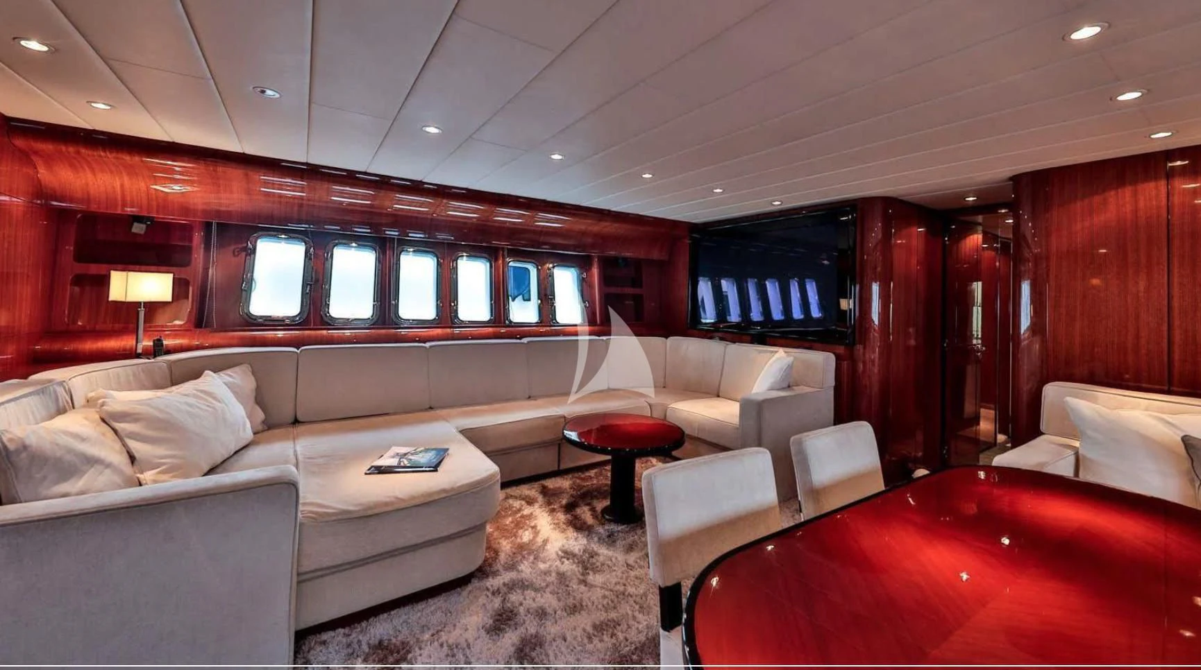 a living room with a couch and a television aboard NOTORIOUS Yacht for Sale