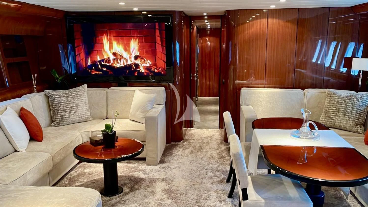 a living room with a large screen aboard NOTORIOUS Yacht for Sale