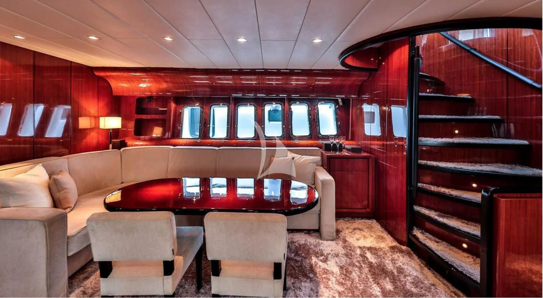 a room with couches and chairs aboard NOTORIOUS Yacht for Sale
