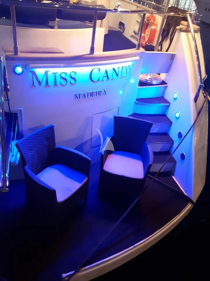 a room with chairs and a shelf aboard MISS CANDY Yacht for Charter