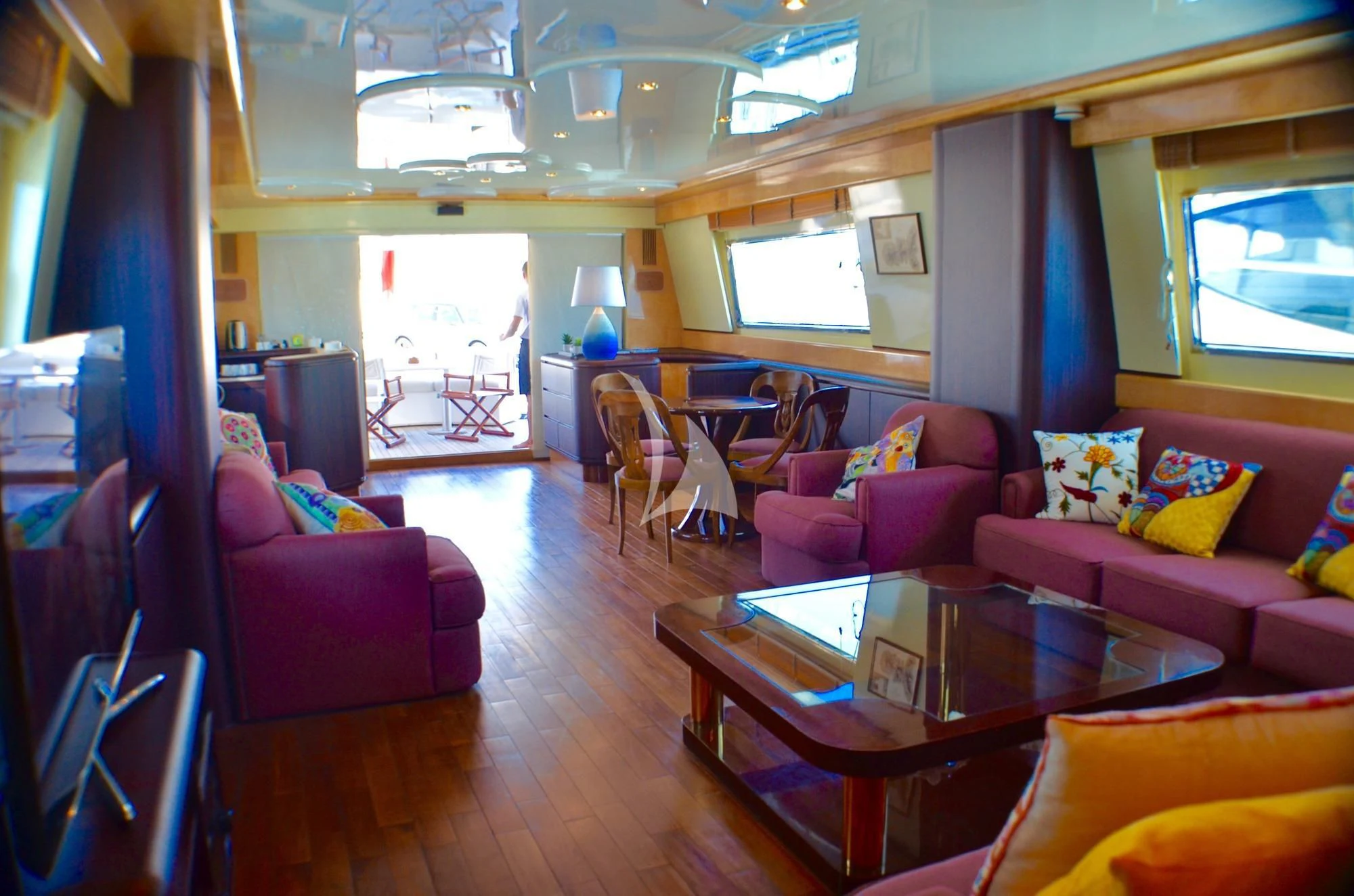 a living room with a table and chairs aboard MISS CANDY Yacht for Charter