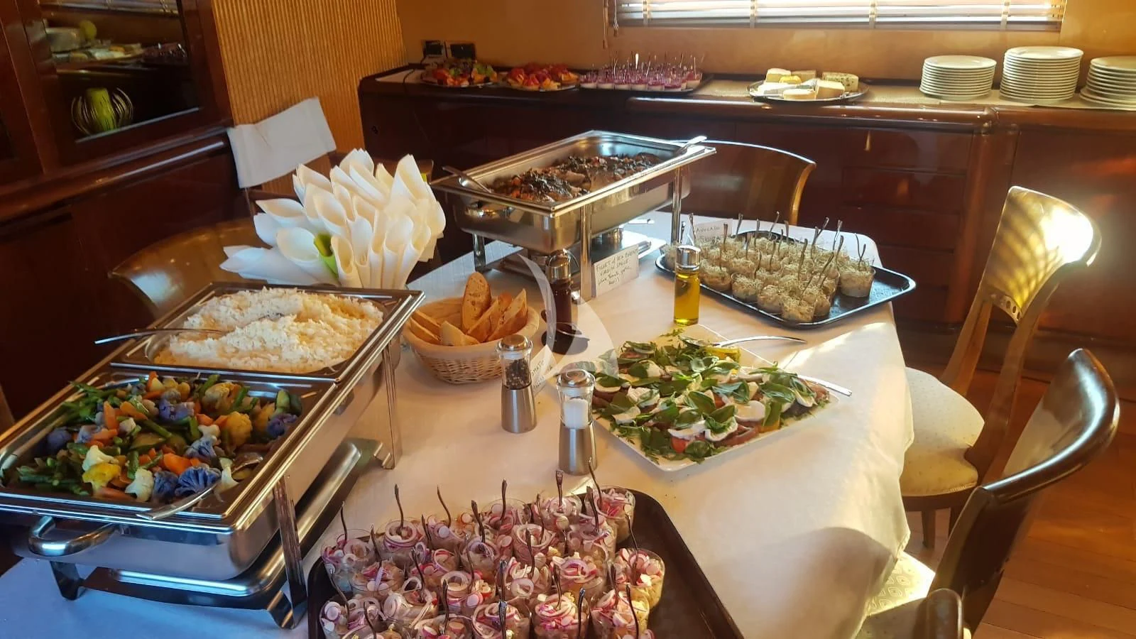a table with food on it aboard MISS CANDY Yacht for Charter