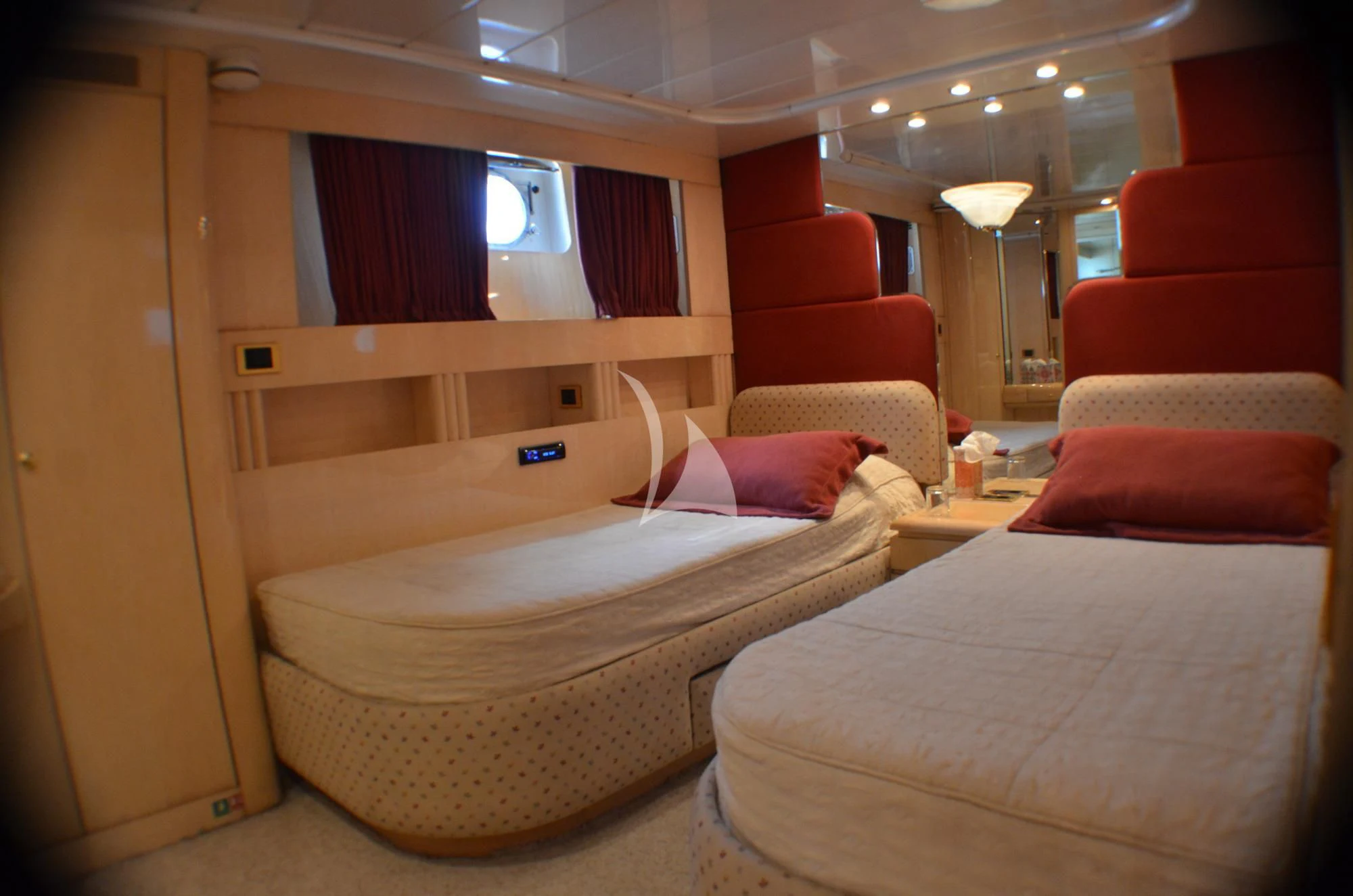 a room with a bed and a shelf with a mirror aboard MISS CANDY Yacht for Charter