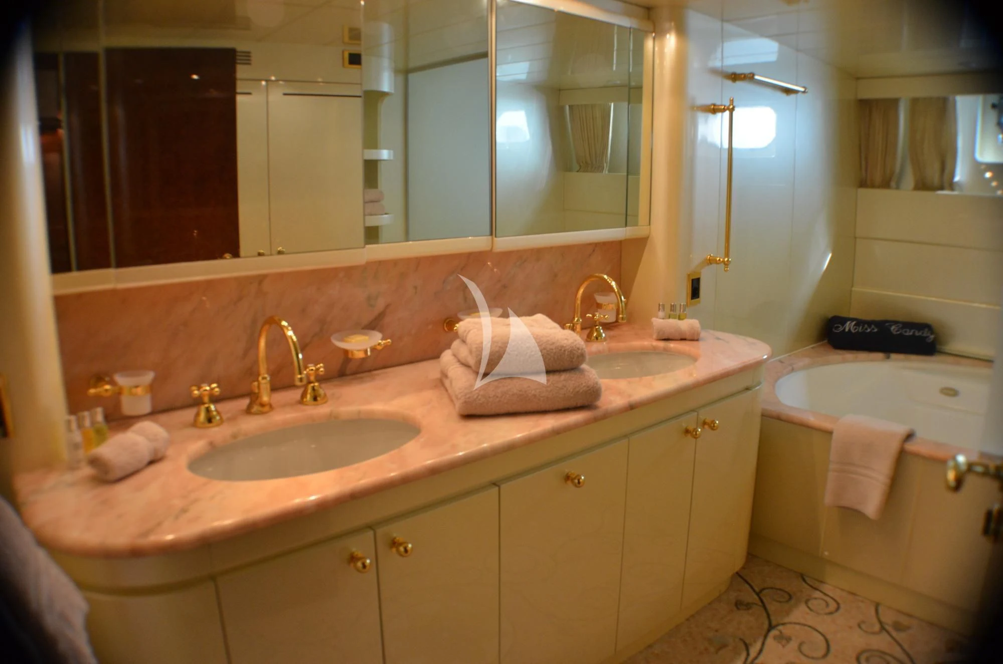 a bathroom with a large mirror aboard MISS CANDY Yacht for Charter