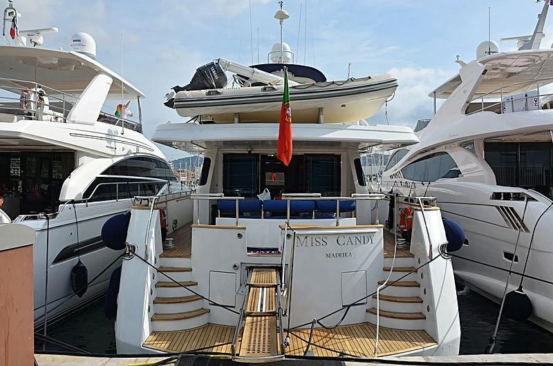 a boat docked at a pier aboard MISS CANDY Yacht for Charter