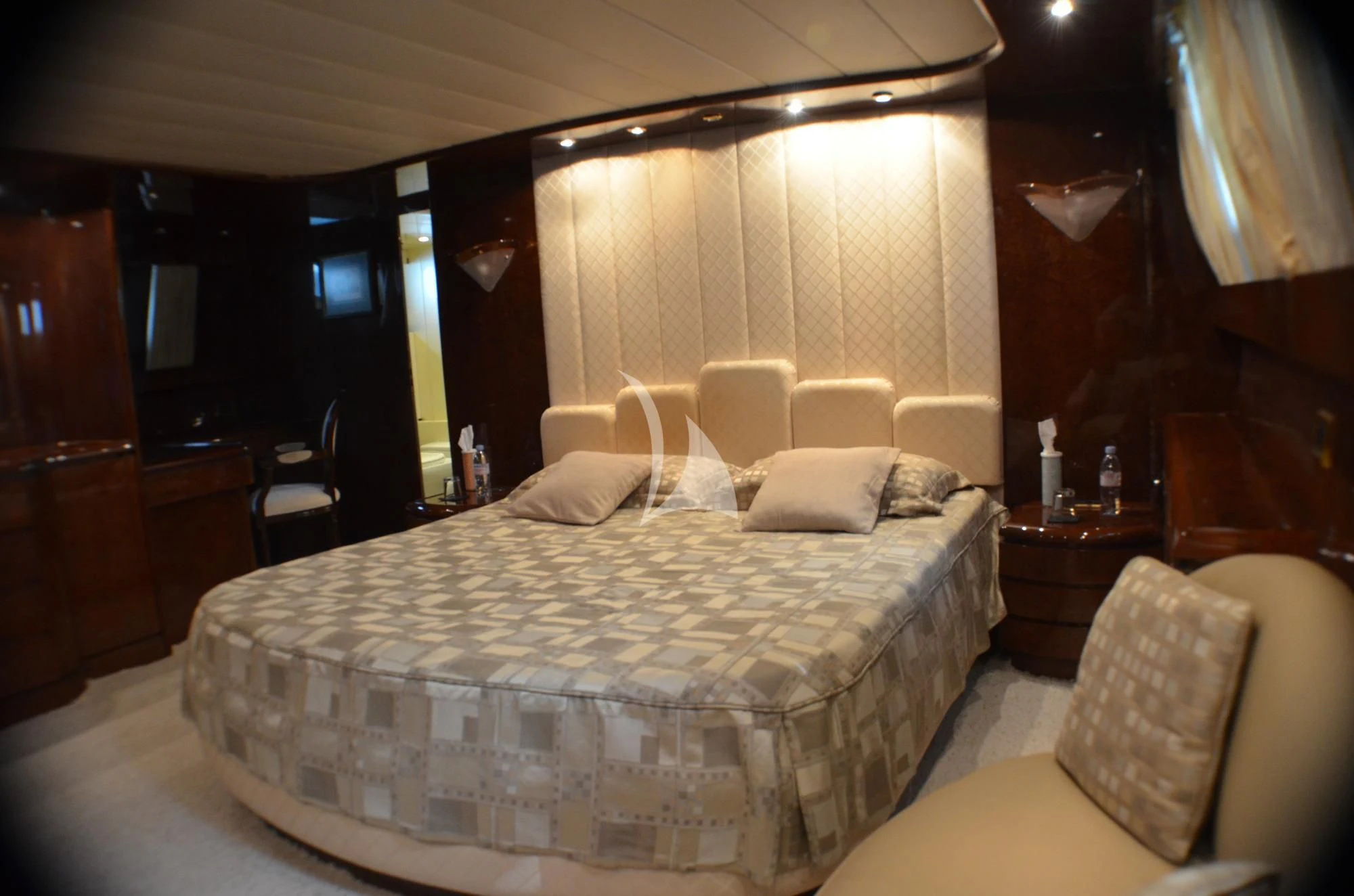 a room with a bed and a couch aboard MISS CANDY Yacht for Charter