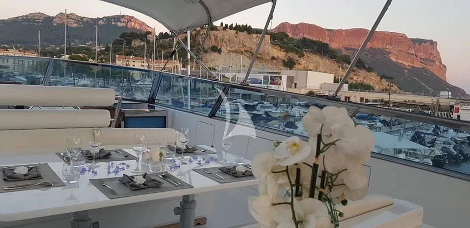 a table with a white tablecloth and a white tablecloth with a white cloth and a white aboard MISS CANDY Yacht for Charter