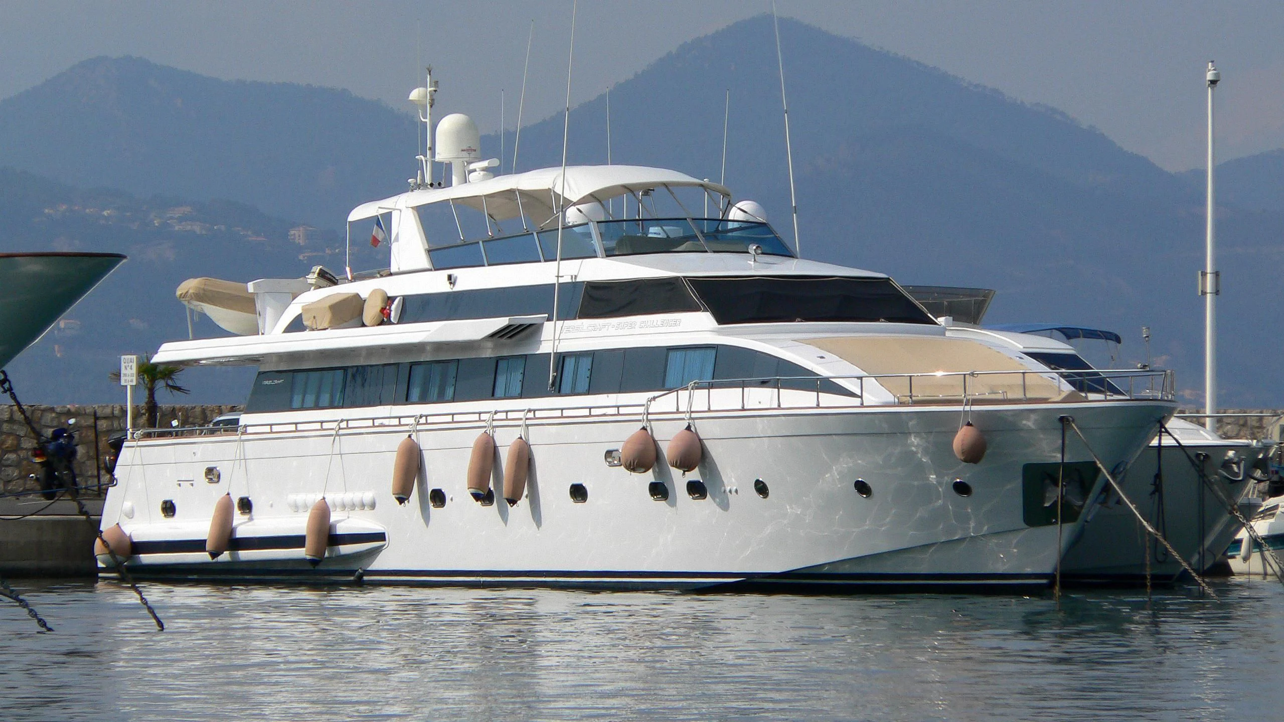 a boat docked at a pier aboard MISS CANDY Yacht for Charter