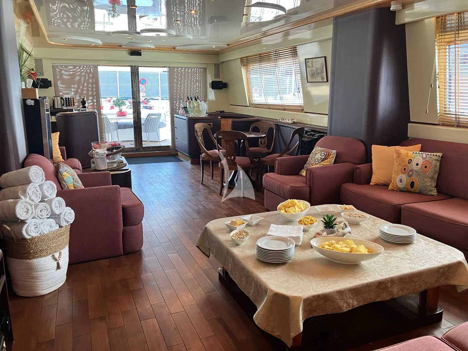 a living room with a table and chairs aboard MISS CANDY Yacht for Charter